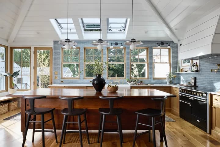 VELUX Fresh Air venting skylights installed in a sloped bedroom ceiling.