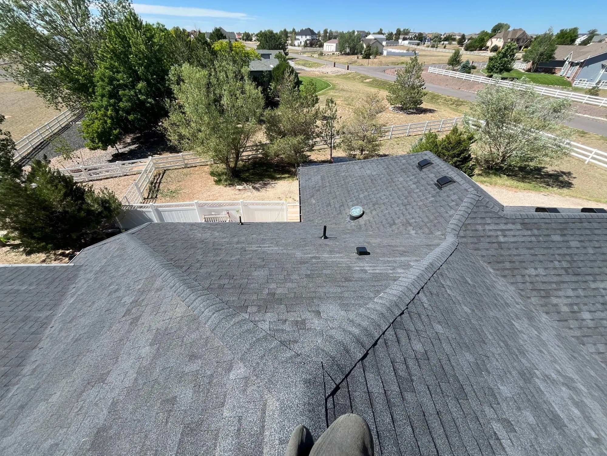 Aerial view of a finished roof replacement on a Brighton property.