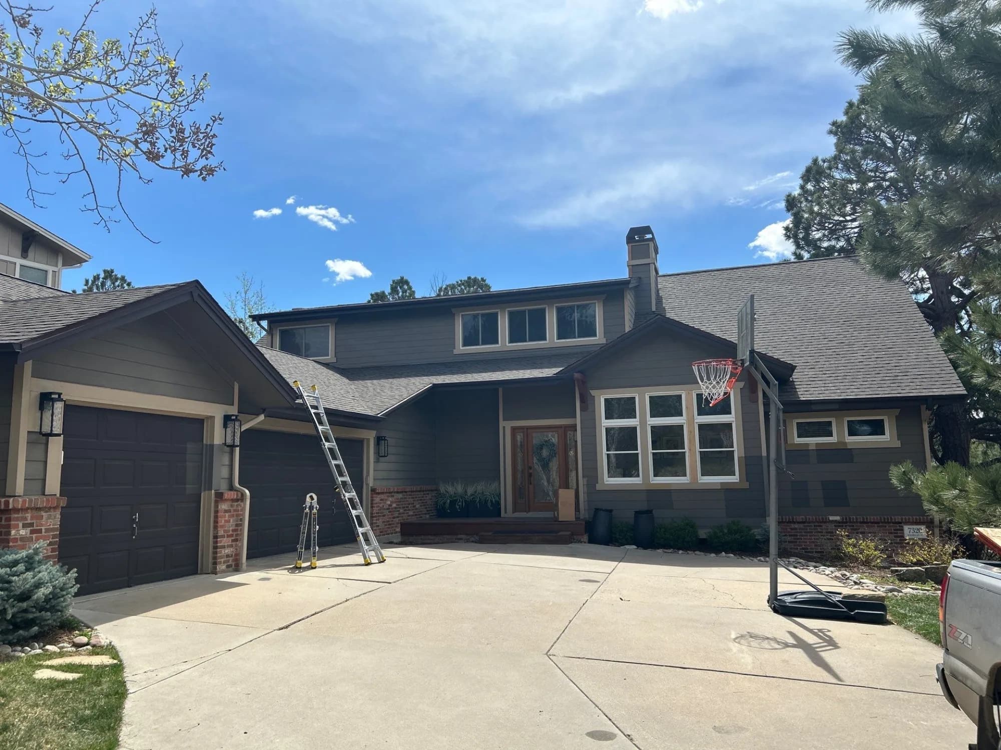 Front elevation of a Castle Pines home with its completed Red Hawk roof replacement.