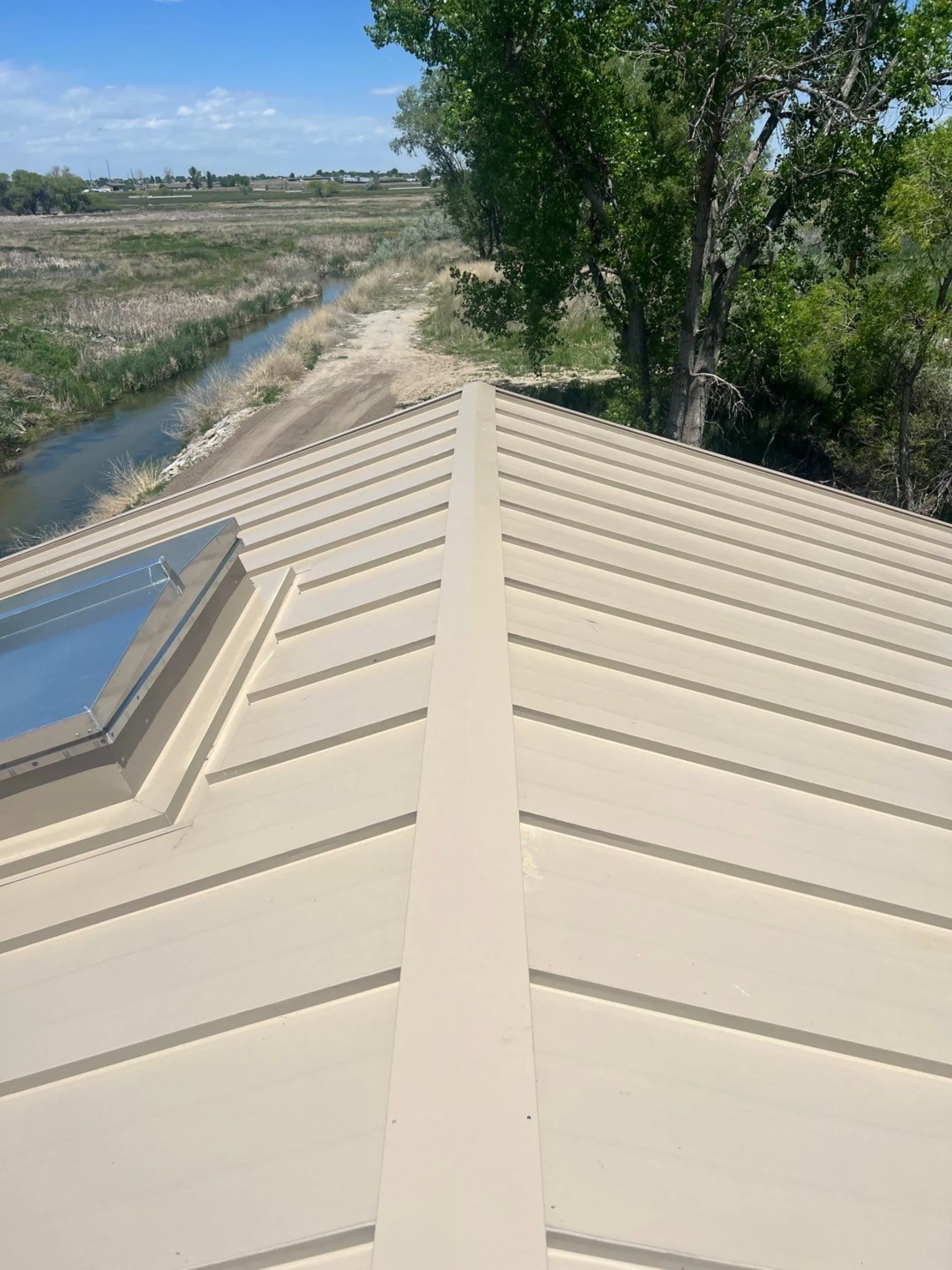 Metal Roof + Skylight Integration — Red Hawk Roofing project